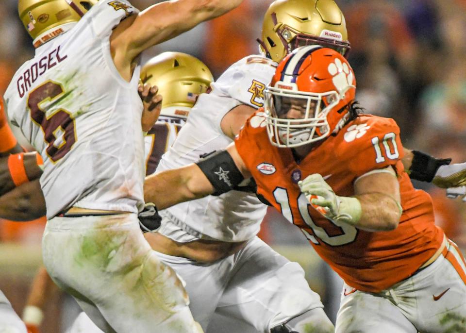 Clemson linebacker Baylon Spector (10) pressures Boston College quarterback Dennis Grosel (6) during the fourth quarter at Memorial Stadium in Clemson, S.C., October 2, 2021. 