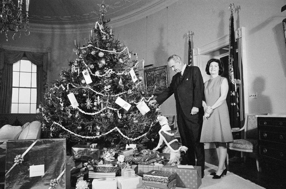 President Lyndon Johnson, Lady Bird Johnson, and dog Yuki on Christmas in 1967.