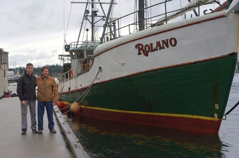 US swimmer Benoit Lecomte (L) stands next to Canadian captain Richard Idiens next to the ship that will accompany him on his swim across the Pacific Ocean from Tokyo to San Francisco