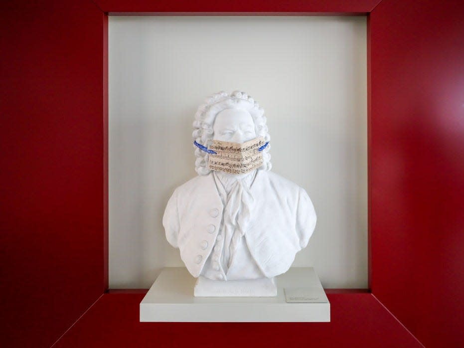 bach sculpture with face mask