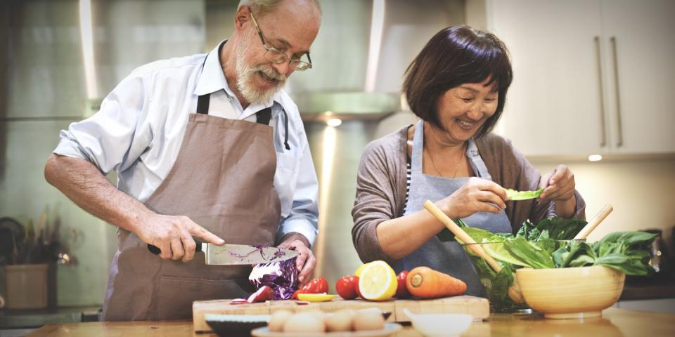 A senior man and woman cooking together. Such activities are common in senior cohousing. <a href="https://www.shutterstock.com/image-photo/family-cooking-kitchen-food-togetherness-concept-342622460?src=-1-7" rel="nofollow noopener" target="_blank" data-ylk="slk:Rawpixel.com/Shutterstock.com;elm:context_link;itc:0;sec:content-canvas" class="link ">Rawpixel.com/Shutterstock.com</a>