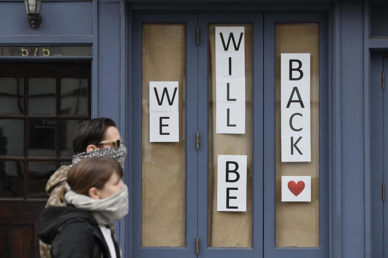 An encouraging sign hangs in West Village restaurant and bar, Hudson Hound in Manhattan, New York.