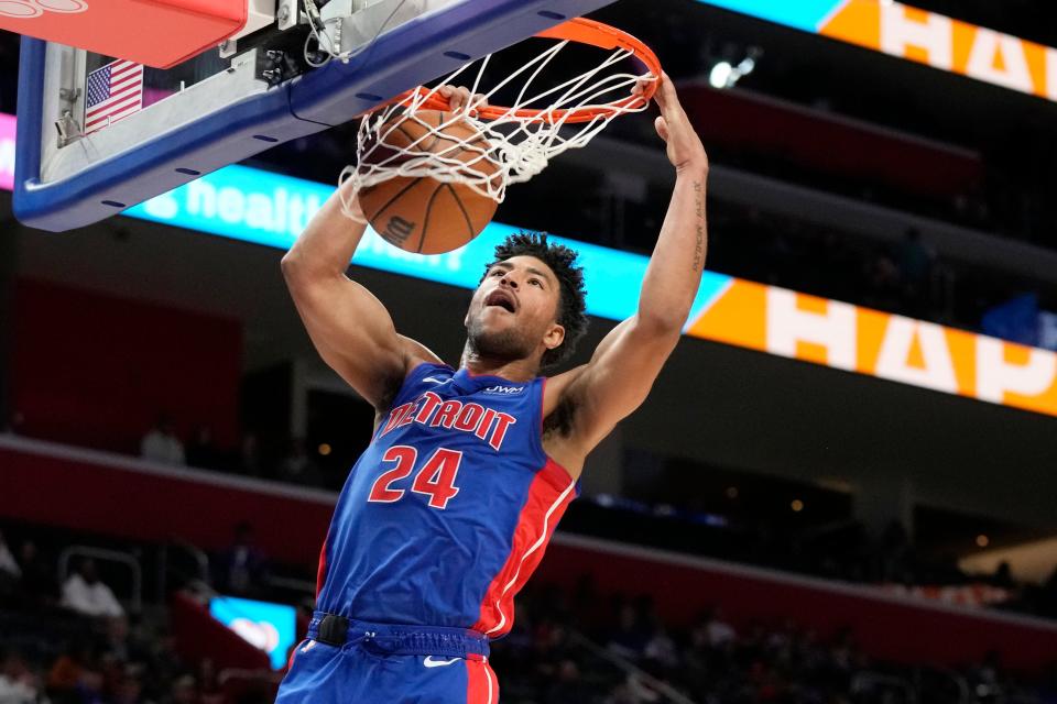 Detroit Pistons guard Quentin Grimes dunks during the first half against the Orlando Magic at Little Caesars Arena in Detroit on Saturday, Feb. 24, 2024.