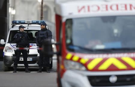 French police and emergency services secure the site near the Louvre Pyramid in Paris, France, February 3, 2017 after a French soldier shot and wounded a man armed with a machete and carrying two bags on his back as he tried to enter the Paris Louvre museum. REUTERS/Christian Hartmann