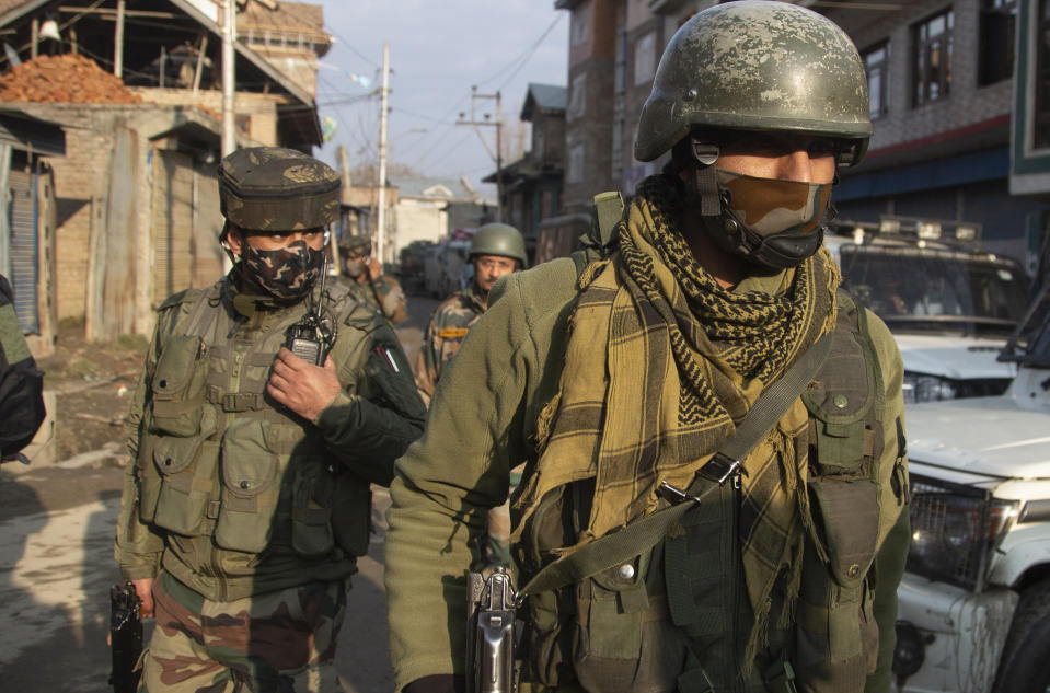 Indian security officers patrol near the site of an attack on the outskirts of Srinagar, Indian controlled Kashmir, Thursday, Nov. 26, 2020. Anti-India rebels in Indian-controlled Kashmir Thursday killed two soldiers in an attack in the disputed region’s main city, the Indian army said.(AP Photo/Mukhtar Khan)