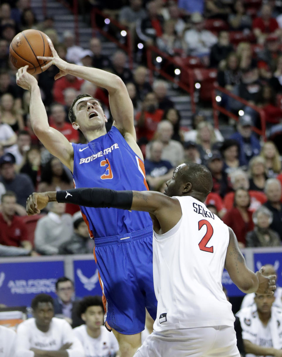 Boise State's Justinian Jessup (3) tries to shoot as San Diego State's Adam Seiko (2) defends during the first half of an NCAA college basketball game in the Mountain West Conference men's tournament Friday, March 6, 2020, in Las Vegas. (AP Photo/Isaac Brekken)