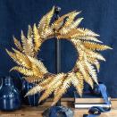 <p>This wreath literally looks like it's made of solid gold—but it's actually made using metallic gold paper, wire, and a grapevine wreath. Get all of the details on how to make it from <a href="https://go.redirectingat.com?id=74968X1596630&url=https%3A%2F%2Fliagriffith.com%2Fgold-paper-fern-wreath%2F&sref=https%3A%2F%2Fwww.housebeautiful.com%2Fentertaining%2Fholidays-celebrations%2Fg22675518%2Feasy-christmas-craft-ideas%2F" rel="nofollow noopener" target="_blank" data-ylk="slk:Lia Griffith;elm:context_link;itc:0;sec:content-canvas" class="link ">Lia Griffith</a>.</p>