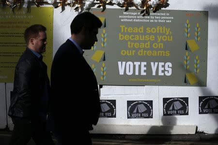 Posters supporting a Yes vote are displayed in the Temple Bar area of Dublin in Ireland May 19, 2015. REUTERS/Cathal McNaughton