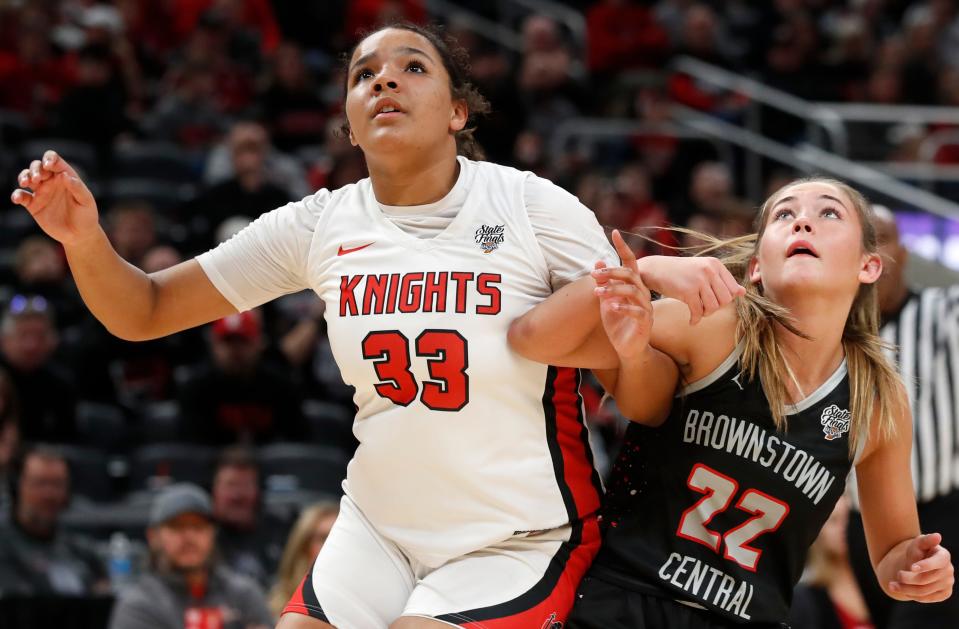 Fort Wayne Bishop Luers Knights forward Miley Wareing (33) boxes out Brownstown Central Braves Kinzee Dean (22) during the IHSAA girls basketball Class 2A state championship, Saturday, Feb. 24, 2024, at Gainbridge Fieldhouse in Indianapolis. Fort Wayne Bishop Luers Knights won 44-36.