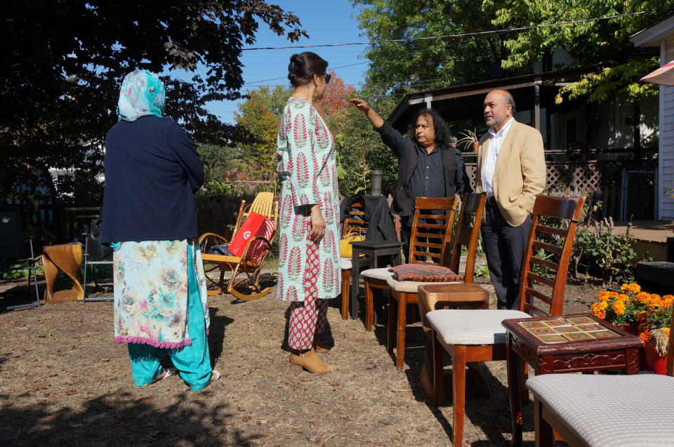 Zafar Siddiqui, right, and other members of the “India Coalition” group gather at the Minneapolis home of Dipankar Mukherjee, second right, and Meena Natarajan on Sunday, Oct. 9, 2022. The group – representing believers in different faiths as well as atheists – meets monthly to discuss how to prevent religious tensions in India from spreading to the Indian diaspora in the United States. (AP Photo/Giovanna Dell’Orto)