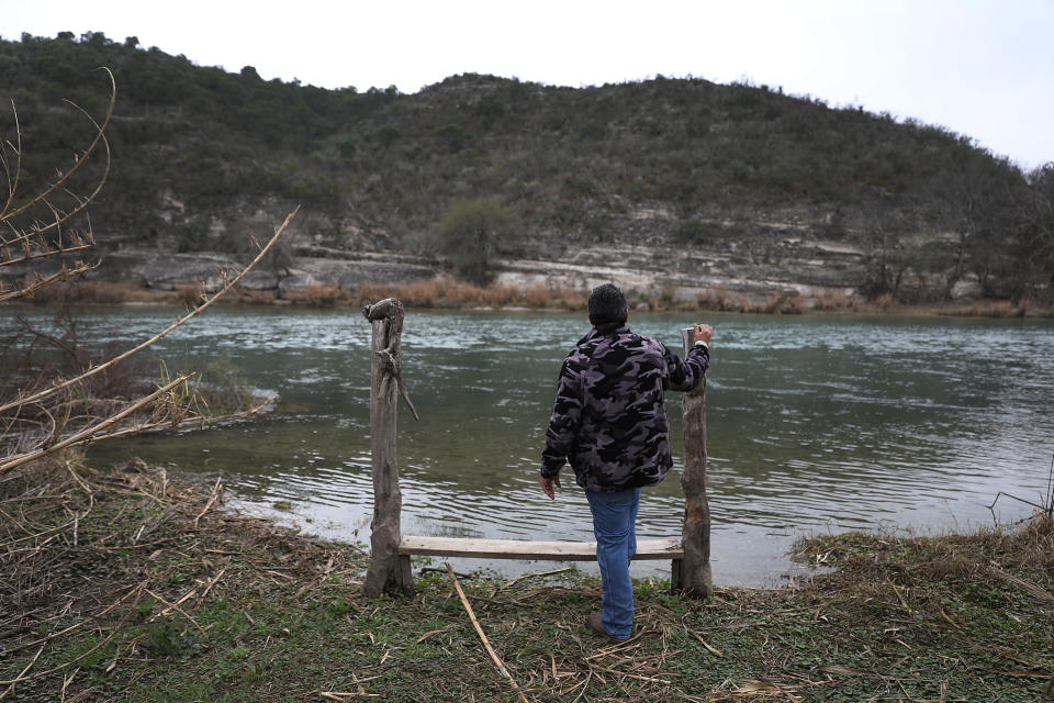 DEL RIO, TEXAS - JANUARY 18:  Leonel Calderon stands next to the Rio Grande river, which marks the boundary between the United States and Mexico, as it flows past the back yard of his home on January 18, 2019 in Del Rio, Texas. The U.S. government is partially shut down as President Donald Trump is asking for $5.7 billion to build additional walls along the U.S.-Mexico border and the Democrats oppose the idea. Mr. Calderon said, ' I think the wall is idiotic and would not want the U.S. government to take the land I have lived on for 10 years by eminent domain powers to make way for the wall.' (Photo by Joe Raedle/Getty Images)