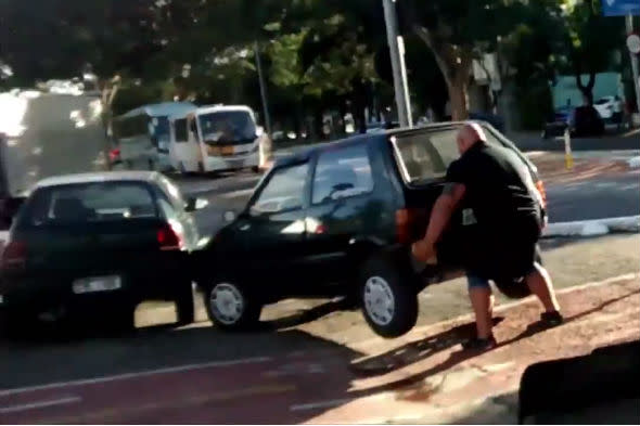 Man lifts car off bike lane