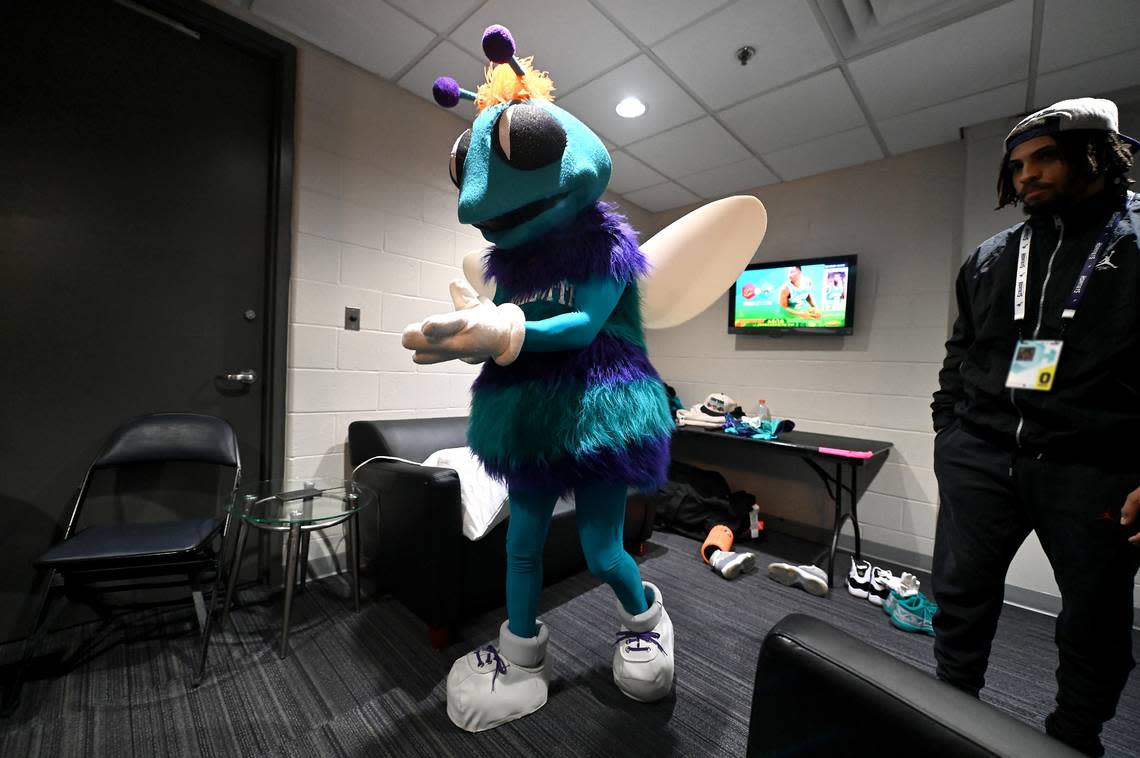 Charlotte Hornets mascot Hugo straightens his gloves as he leaves his dressing room at Spectrum Center in Charlotte, NC on Friday, March 15, 2024.