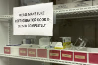 Vaccines are held in a refrigerator at First Georgia Physician Group Pediatrics in Fayetteville, Ga., Tuesday, Aug. 17, 2021. The vaccinations that U.S. schoolchildren are required to get to hold terrible diseases like polio, hepatitis, tetanus and whooping cough in check are way behind schedule this year, threatening further complications to a school year already marred by COVID-19. (AP Photo/Angie Wang)