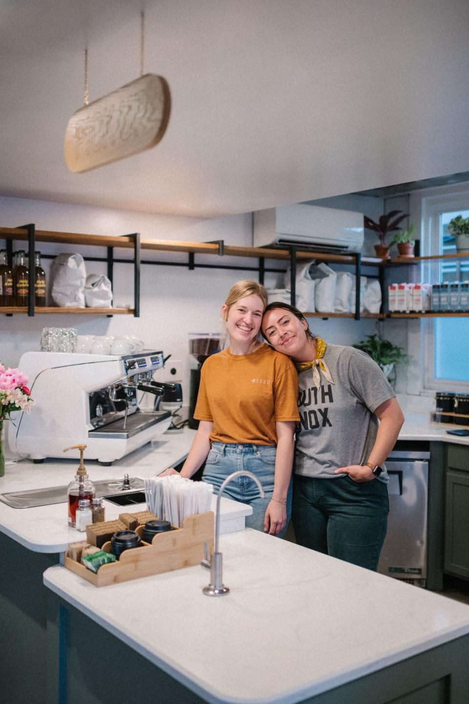 Entrepreneurs Morgan Benson, left, and Andrea Land stand in the coffee bar area of Seed Coffee Co.