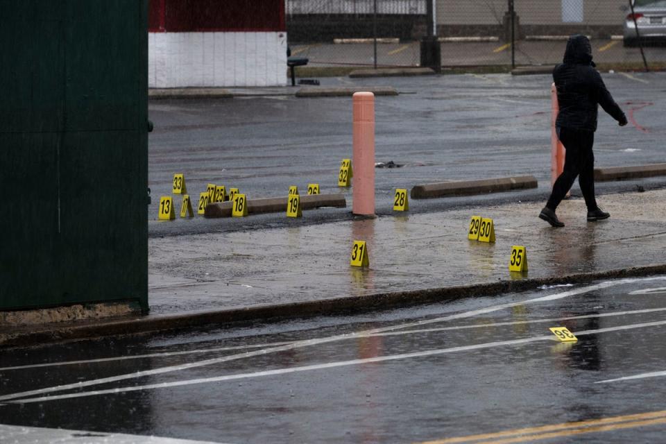 Evidence markers dot the ground following a shooting in northeast Philadelphia on Wednesday (AP)