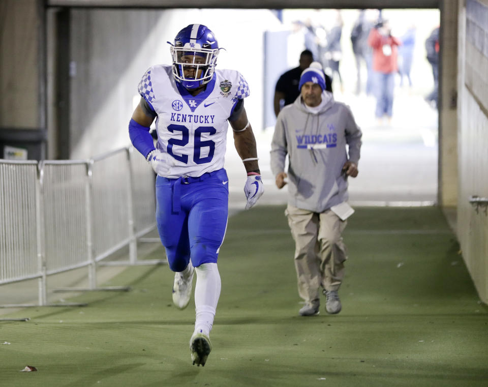 Kentucky running back Benny Snell Jr. (26) runs to the locker room after being ejected in the first half of the Music City Bowl NCAA college football game against Northwestern, Friday, Dec. 29, 2017, in Nashville, Tenn. (AP Photo/Mark Humphrey)