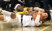 Colorado guard KJ Simpson, front, tussles for control of the ball with Arizona State guard Marreon Jackson during the first half of an NCAA college basketball game Thursday, Feb. 24, 2022, in Boulder, Colo. (AP Photo/David Zalubowski)