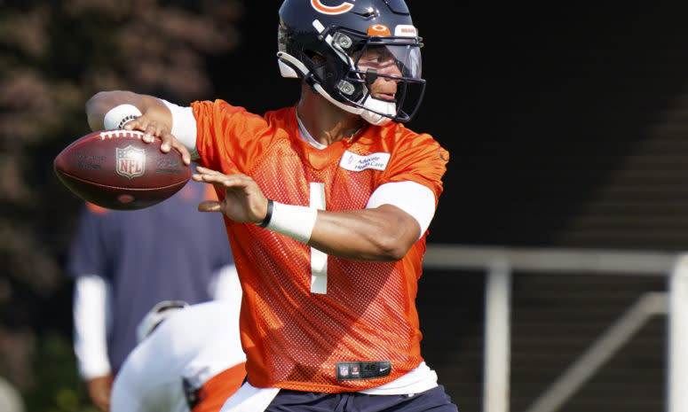 Justin Fields throws a pass during Bears training camp.