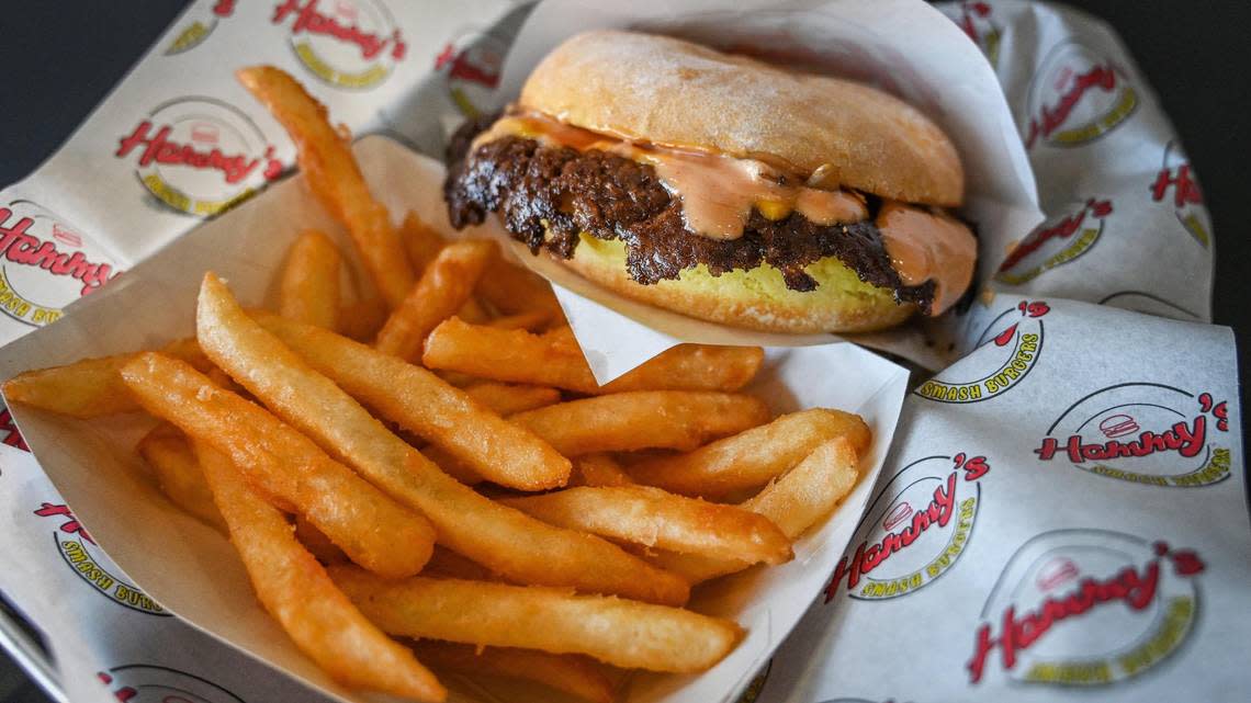 An original smash burger, prepared with grilled onions, cheese and special sauce, is plated with crispy fries at Hammy’s Smash Burgers on West Shaw Avenue on Tuesday, Oct. 25, 2022.