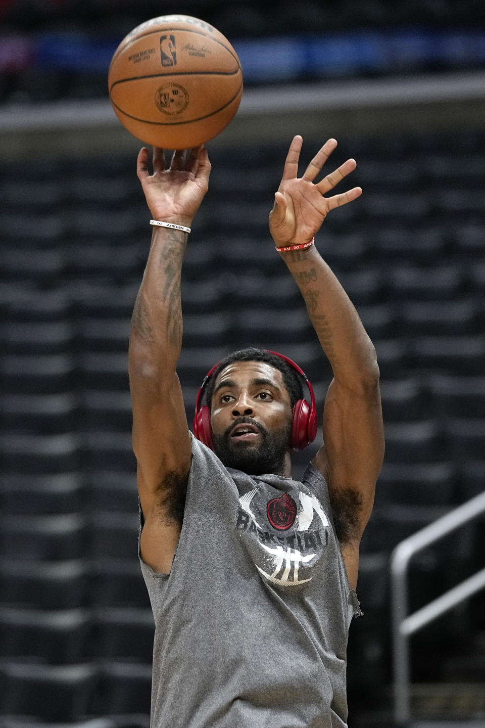 Dallas Mavericks guard Kyrie Irving warms up prior to an NBA basketball game against the Los Angeles Clippers Wednesday, Feb. 8, 2023, in Los Angeles. (AP Photo/Mark J. Terrill)