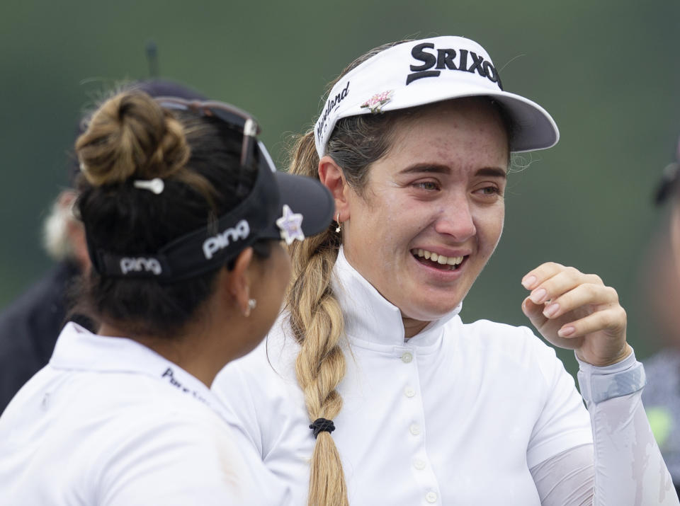 Hannah Green, of Australia, is over come with emotions as she is congratulated after winning the KPMG Women's PGA Championship golf tournament, Sunday, June 23, 2019, in Chaska, Minn. (AP Photo/Andy Clayton-King)