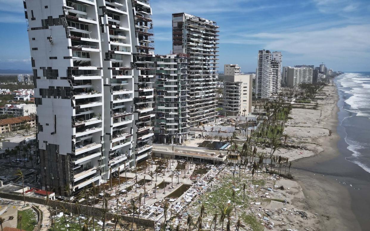 Acapulco's beachfront condo towers were devastated by Hurricane Otis. <a href="https://www.gettyimages.com/detail/news-photo/aerial-view-of-damages-caused-by-the-passage-of-hurricane-news-photo/1750791993" rel="nofollow noopener" target="_blank" data-ylk="slk:Rodrigo Oropeza/AFP via Getty Images;elm:context_link;itc:0;sec:content-canvas" class="link ">Rodrigo Oropeza/AFP via Getty Images</a>