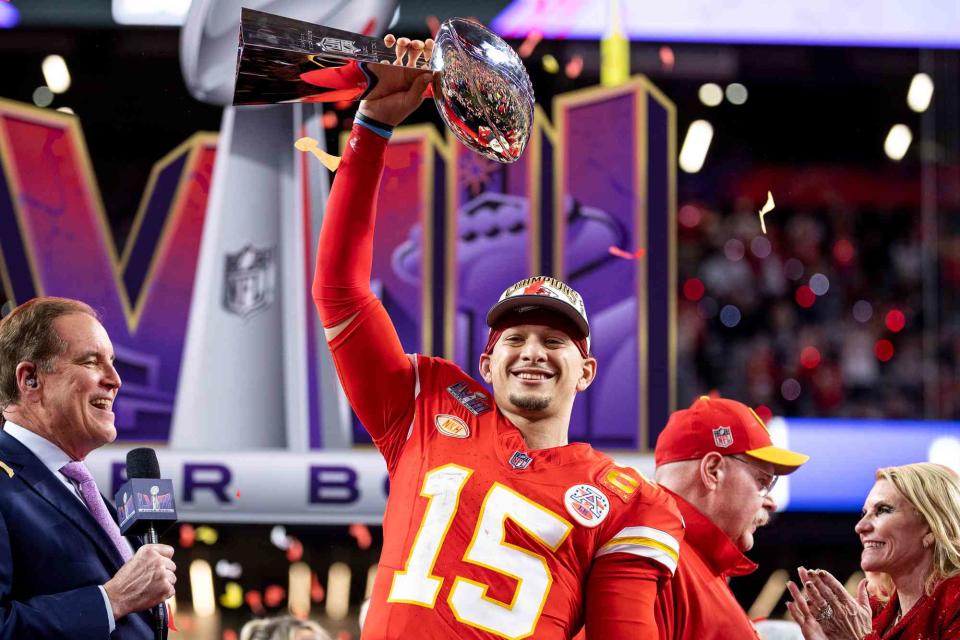 <p>Michael Owens/Getty</p> Patrick Mahomes #15 of the Kansas City Chiefs celebrates with the Vince Lombardi Trophy following the NFL Super Bowl 58 football game between the San Francisco 49ers and the Kansas City Chiefs at Allegiant Stadium on February 11, 2024