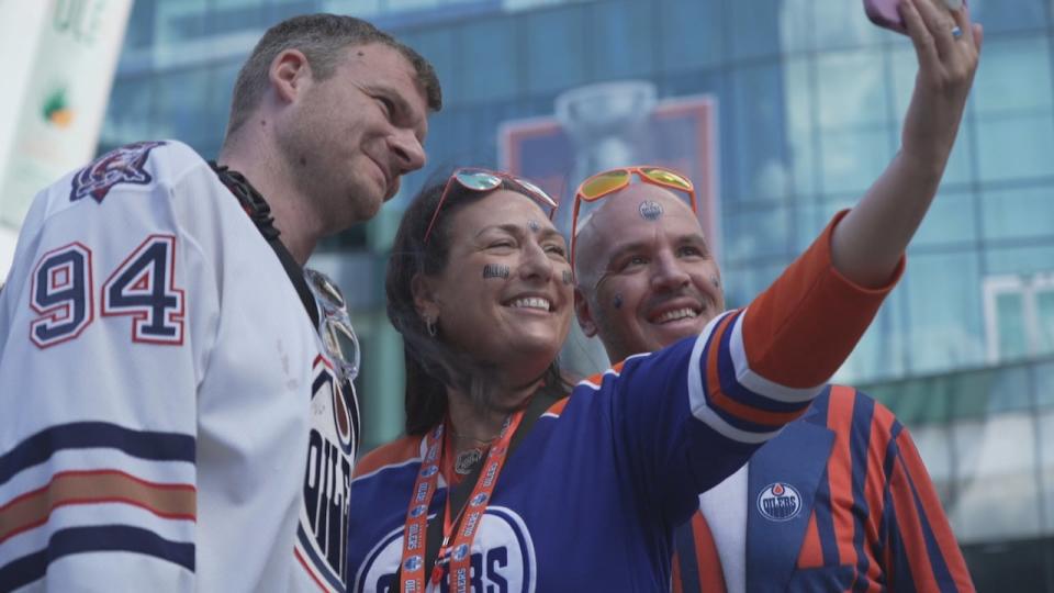 Christian Hügel, left, became an Edmonton Oilers fan in the late 1990s while growing up in Germany. On Tuesday, in Sunrise, Fla., for Game 5 of the Stanley Cup final, he met Mike Reimer and Nancy Lavoie, right and centre, who later invited him to stay with them for Game 6 in Edmonton.