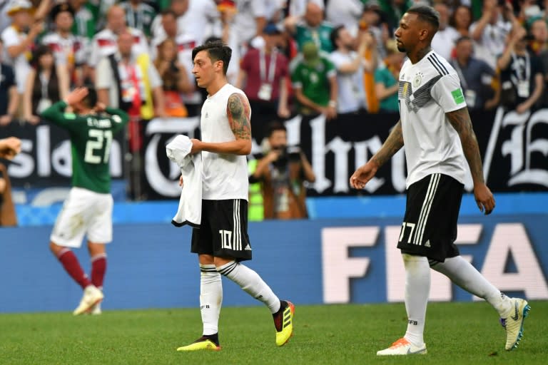 Mesut Ozil (L) took to Instagram to thank his former Germany team-mate defender Jerome Boateng (R) for publically supporting him in the wake of the Arsenal midfielder's controversial retirement from international football