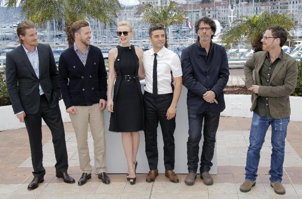 From left, actors Garrett Hedlund, Justin Timberlake, Carey Mulligan, Oscar Isaac, and directors Joel and Ethan Coen pose for photographers during a photo call for the film Inside Llewyn Davis at the 66th international film festival, in Cannes, southern France, Sunday, May 19, 2013. (AP Photo/Lionel Cironneau)