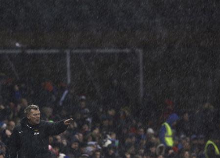 Manchester United's manager David Moyes points during their English League Cup quarter-final soccer match against Stoke City at the Britannia stadium in Stoke-on-Trent, central England, December 18, 2013. REUTERS/Darren Staples