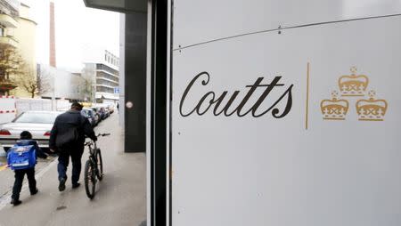 The logo of British bank Coutts is seen at the entrance of an office building in Zurich March 27, 2015. REUTERS/Arnd Wiegmann