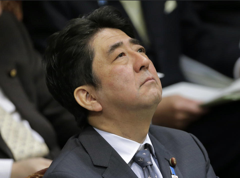 FILE - Then Japanese Prime Minister Shinzo Abe listens to a question during a budget committee meeting at Parliament in Tokyo, Tuesday, Feb. 26, 2013. Former Japanese Prime Minister Abe, a divisive arch-conservative and one of his nation's most powerful and influential figures, has died after being shot during a campaign speech Friday, July 8, 2022, in western Japan, hospital officials said. (AP Photo/Itsuo Inouyek, File)