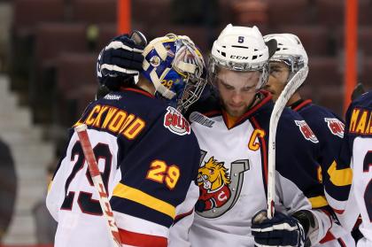 OTTAWA, ON - MARCH 13: Aaron Ekblad #5 congratulates teammate Mackenzie Blackwood #29 of the Barrie Colts following a win against the Ottawa 67&#39;s during an OHL game at Canadian Tire Centre on March 13, 2014 in Ottawa, Ontario, Canada. (Photo by Jana Chytilova/Freestyle Photography/Getty Images)