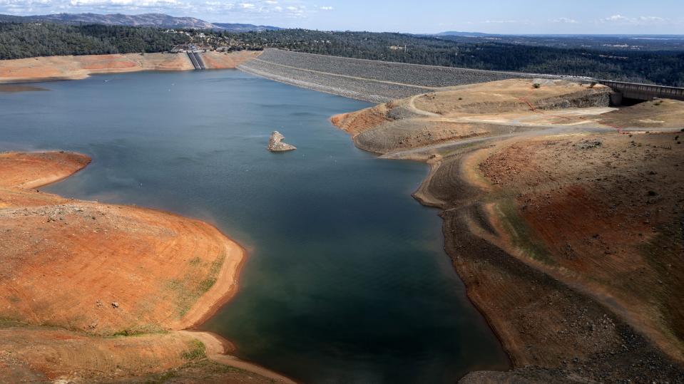 FILE - Dry hillsides surround Lake Oroville on May 22, 2021, in Oroville, Calif. Months of winter storms have replenished California's key reservoirs after three years of punishing drought. (AP Photo/Noah Berger, File)