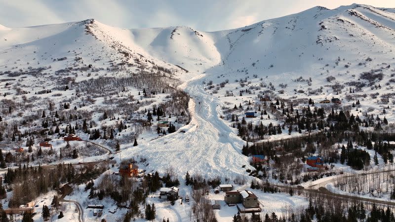 Drone footage shows the aftermath of an avalanche down a mountainside at Hiland Road in Anchorage