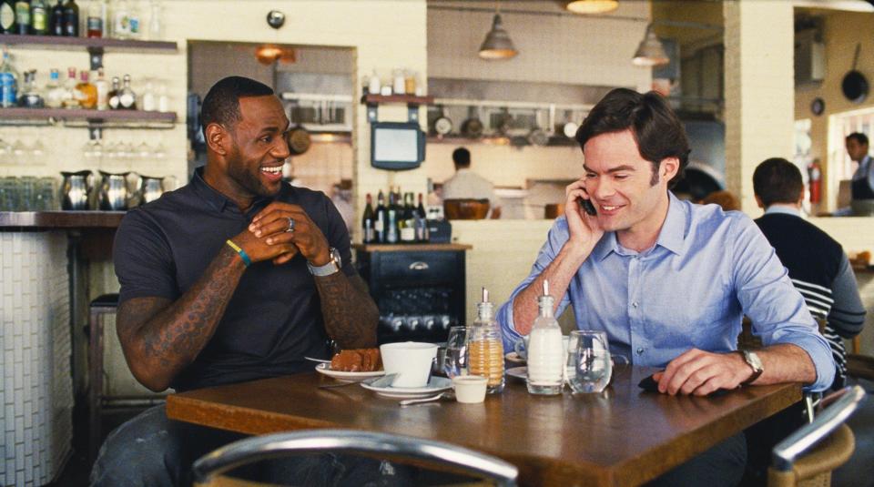 James and Bill Hader laugh together over coffee in the film