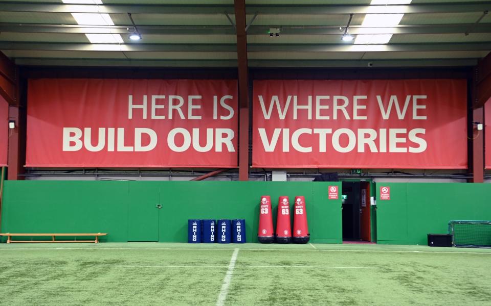 A picture inside the Wales indoor training centre with a sign saying 'here is where we build our victories' on the wall - Jay Williams