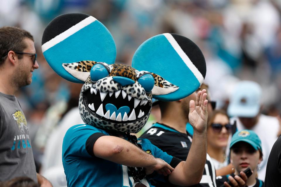 Week 2: A fan in a unique Jaguars mask cheers during Jacksonville's game against the Indianapolis Colts at TIAA Bank Field.