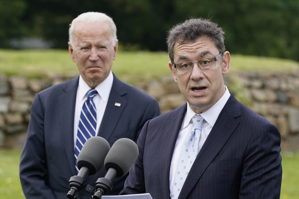 FILE - In this June 10, 2021, file photo President Joe Biden listens as Pfizer CEO Albert Bourla speaks about the Biden administration's global COVID-19 vaccination efforts ahead of the G-7 summit in St. Ives, England. (AP Photo/Patrick Semansky, File)