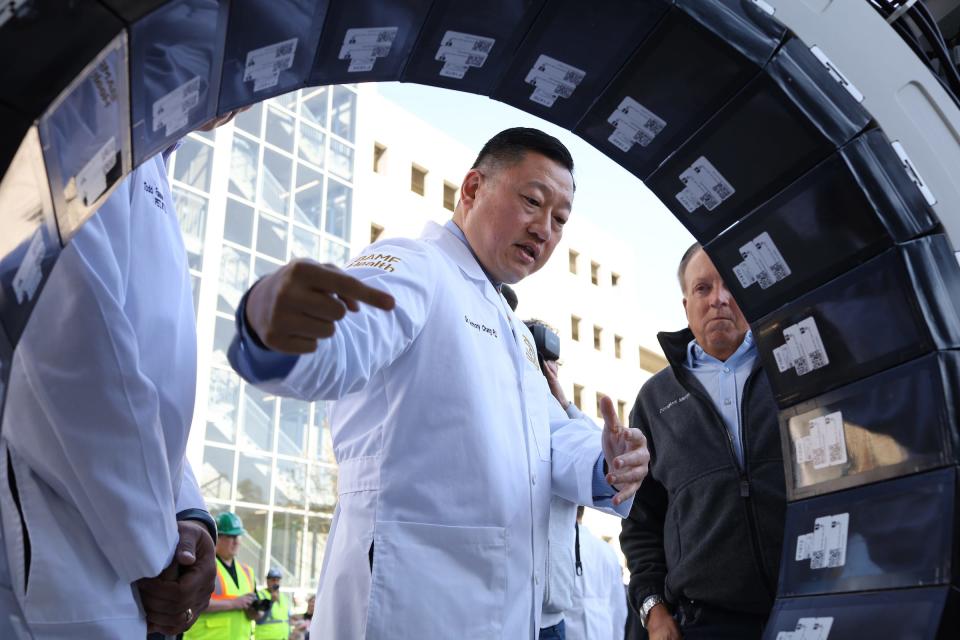 Anthony Chang, CEO and founder of Bold Advanced Medical Future Health, is seen with a piece of a full-body PET-CT scanner, which arrived at the Michigan State University radiopharmacy in Grand Rapids on Monday, May 9, 2022.