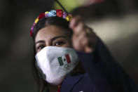 A member from Team Mexico arrives during the opening ceremony in the Olympic Stadium at the 2020 Summer Olympics, Friday, July 23, 2021, in Tokyo, Japan. (Hannah McKay/Pool Photo via AP)