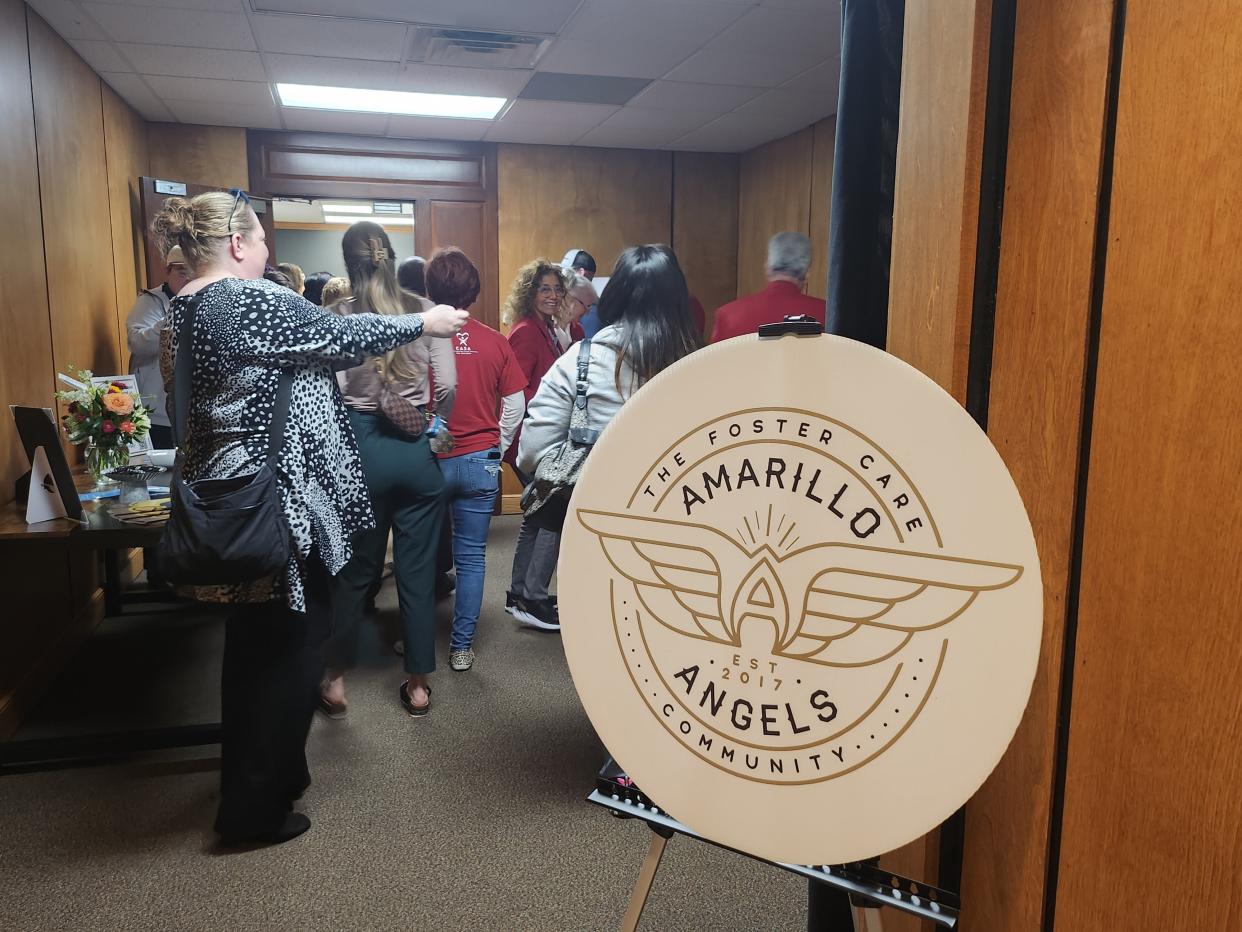Crowds wait to enter as Amarillo Angels celebrates its seventh anniversary with grand opening of its new office and a ribbon cutting held Wednesday afternoon.
