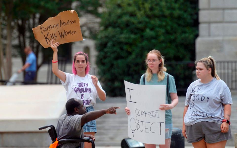 Abortions rights supporters protest outside the South Carolina Statehouse  - AP Photo/Meg Kinnard