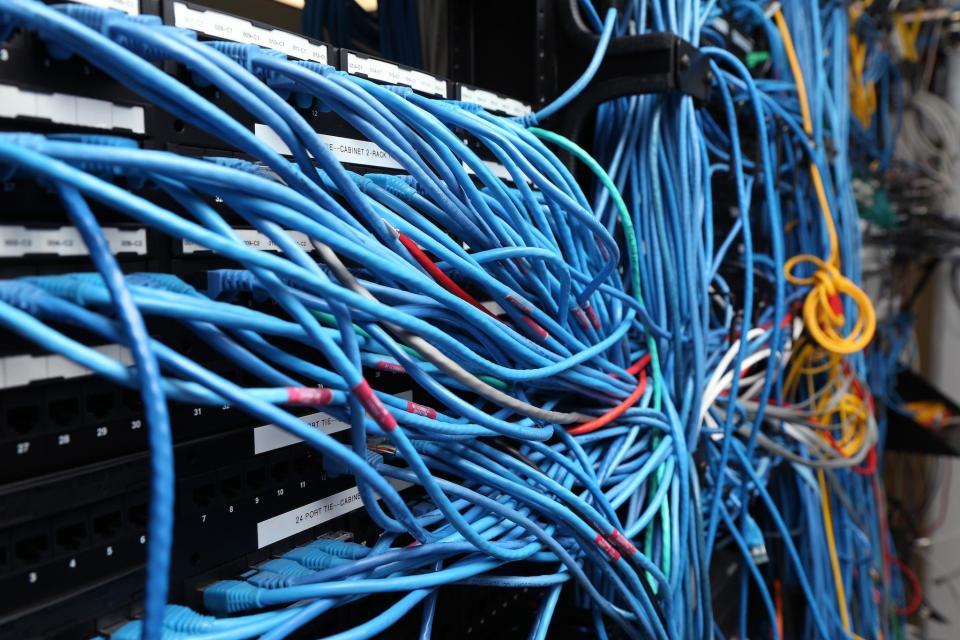 Network cables are plugged in a server room on November 10, 2014 in New York City: Michael Bocchieri/Getty Images)