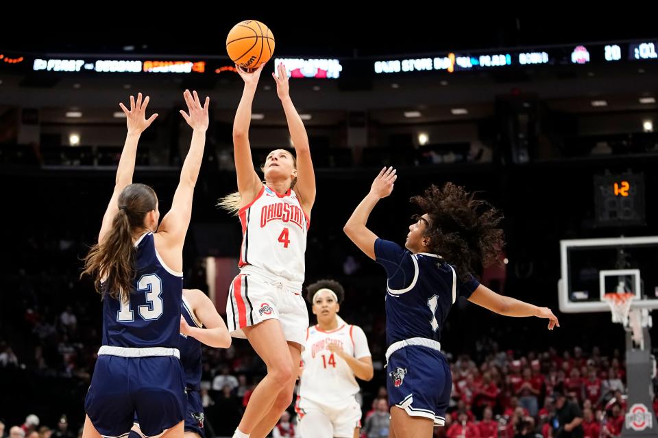 Mar 22, 2024; Columbus, OH, USA; Ohio State Buckeyes guard Jacy Sheldon (4) shoots over Maine Black Bears guard Caroline Bornemann (13) and guard Olivia Rockwood (1) during the first half of the women’s basketball NCAA Tournament at Value City Arena.