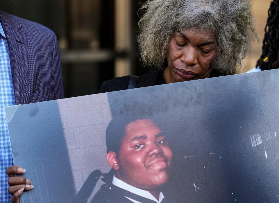 Gladys Whitfield looks down at a photo of her late son, Herman Whitfield III, during a press conference on Thursday, April 13, 2023, in reaction to the indictment of the Indianapolis police officers who killed him nearly a year ago. On April 25, 2022, five IMPD officers and a recruit trainee were called to Whitfield’s parents' home. Police tased and handcuffed him, naked and face down on the ground, while he was in the throes of a mental health episode. Whitfield died shortly after arriving at a hospital. 