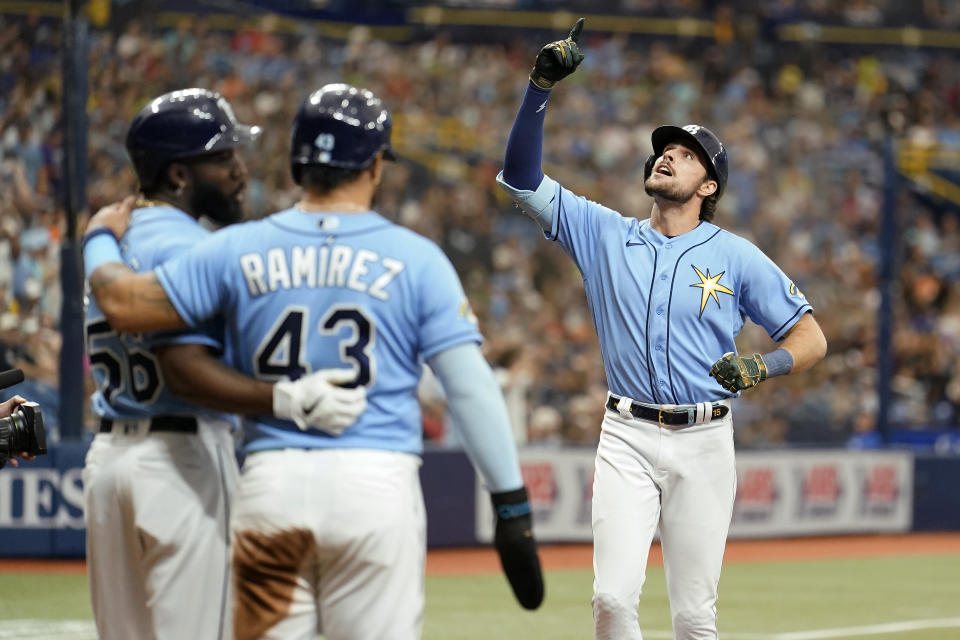 Tampa Bay Rays' Josh Lowe, right, celebrates his three-run home run off Milwaukee Brewers starting pitcher Freddy Peralta during the fourth inning of a baseball game Sunday, May 21, 2023, in St. Petersburg, Fla. (AP Photo/Chris O'Meara)