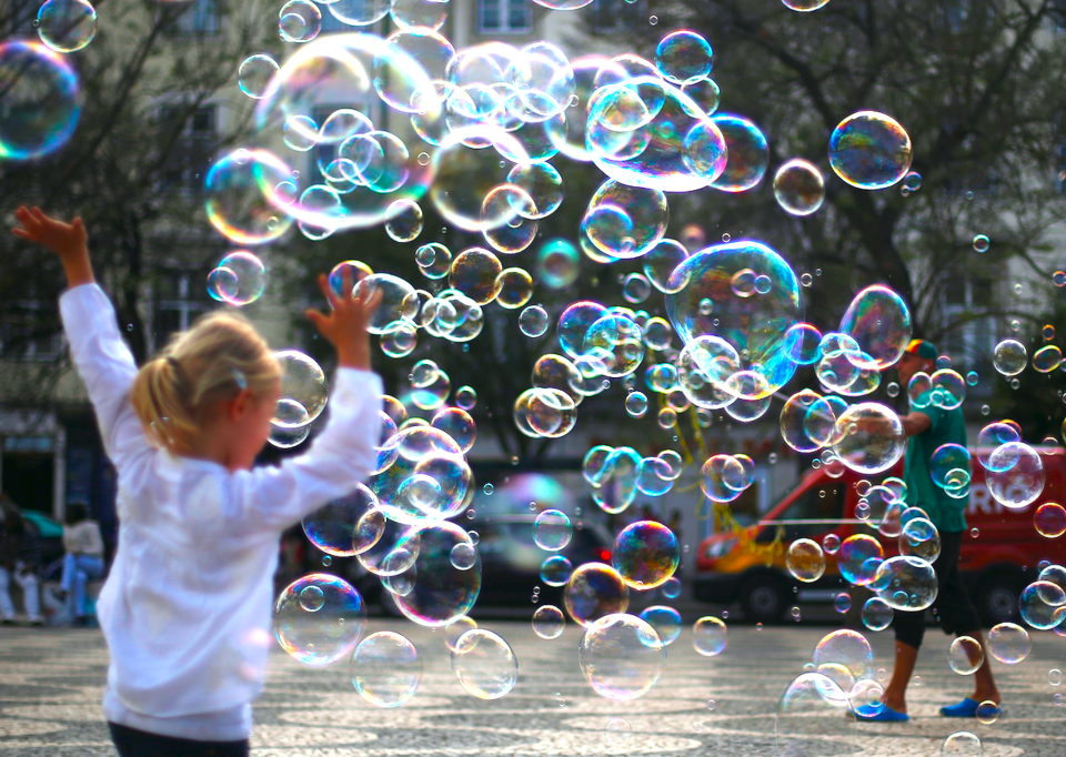 A street artist performs with soap bubbles at Rossio square in downtown Lisbon, Portugal April 28, 2017. REUTERS